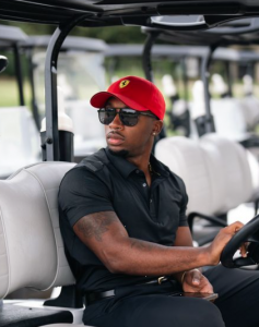 Joovier from Joovier's Gems Day Trader sitting on golf cart